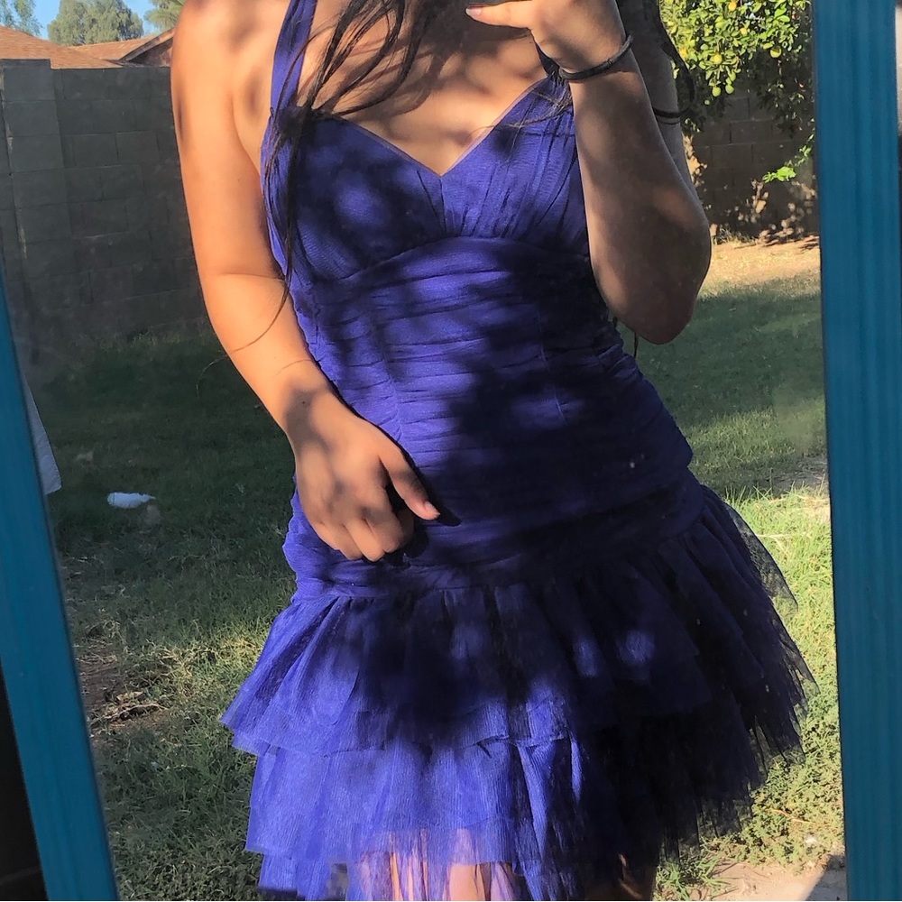 Blue knee length dress.
